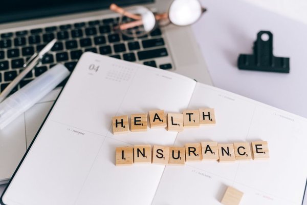 group health insurance vs individual UK